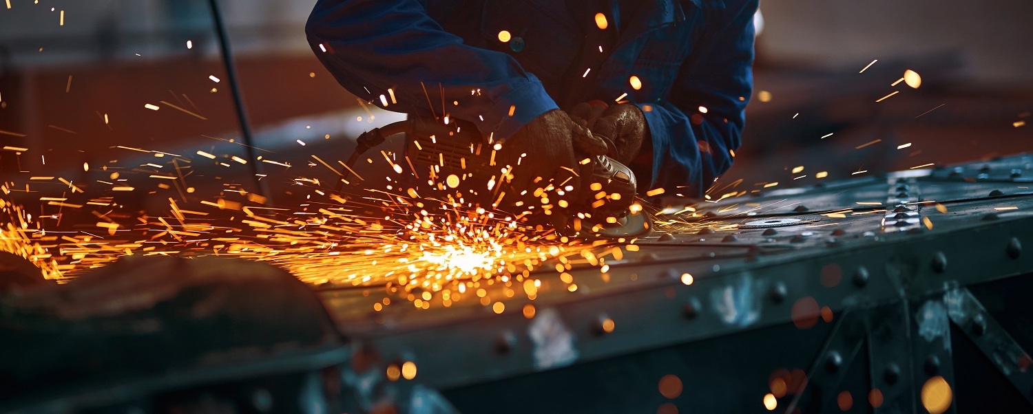 Process creating modern fence with orange sparks.
